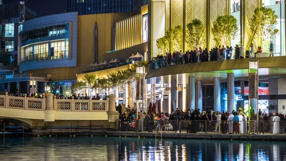 of Dubai Mall with Night Illumination. People Watching a Show of ...