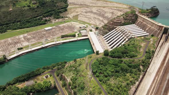 Cinematic drone footage - flying sideways over the river showing a hydroeletric at minas gerais in B alt