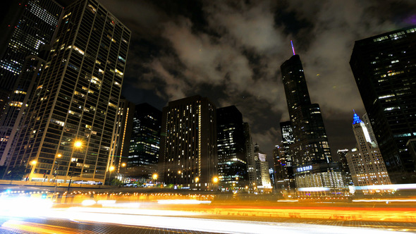 Chicago Skyscrapers at Night with Cars Crossing the City