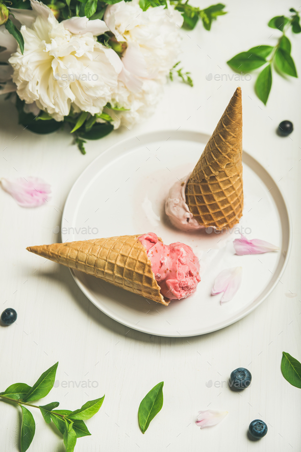 Ice cream scoops and peony flowers over white background - Stock Photo - Images