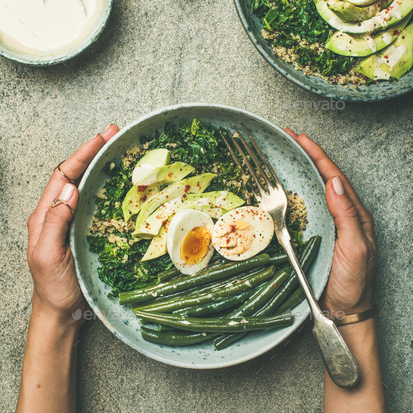 Quinoa, kale, green beans, avocado, egg bowls flat-lay, square crop - Stock Photo - Images