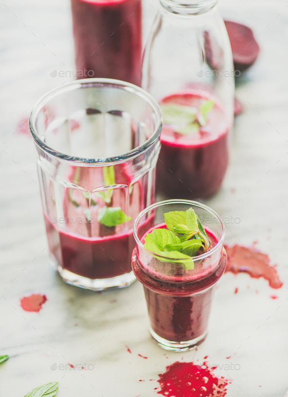 Fresh morning beetroot smoothie with mint in glass and bottle - Stock Photo - Images