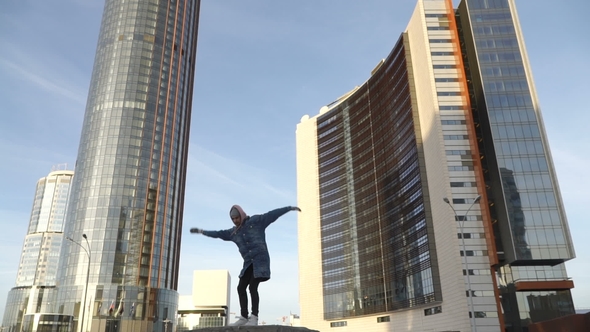 Young Man Is Dancing Outdoors alt