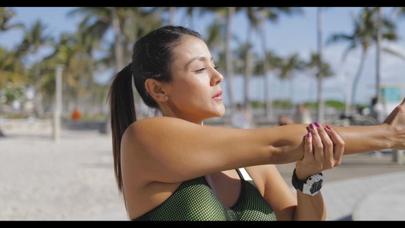 Woman Standing and Stretching alt