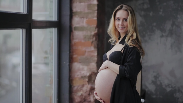Beautiful Young Pregnant Woman Is Rubbing Her Belly Stock Footage 