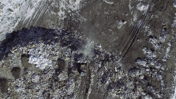 AERIAL: Movie of a Truck Working in a Landfill