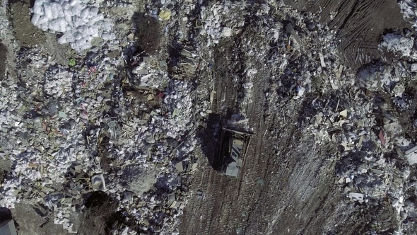 AERIAL: Movie of a Truck Working in a Landfill