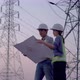 Two specialist electrical engineer working near to High voltage tower. - VideoHive Item for Sale
