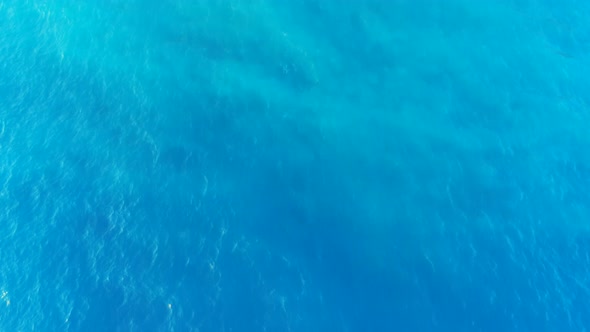Aerial Top Down View of Turquoise Waters and Waves of Mediterranean Sea in Crete