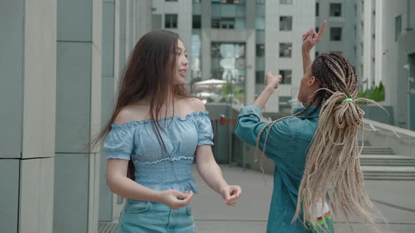 Model Teen Friends Asian and Mixed Race Girls People in Stylish Clothing Dance Having Fun Outdoors alt