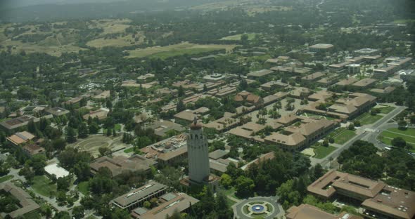 Nighttime helicopter aerial of downtown cityscape during fireworks alt