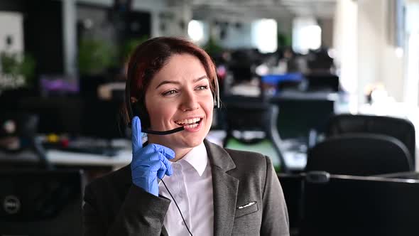 Portrait of a Friendly Female Call Center Operator alt