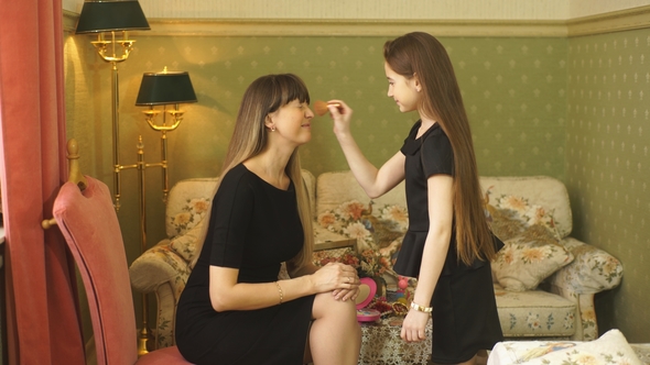 Little Girl Playing with Her Mom's Makeup