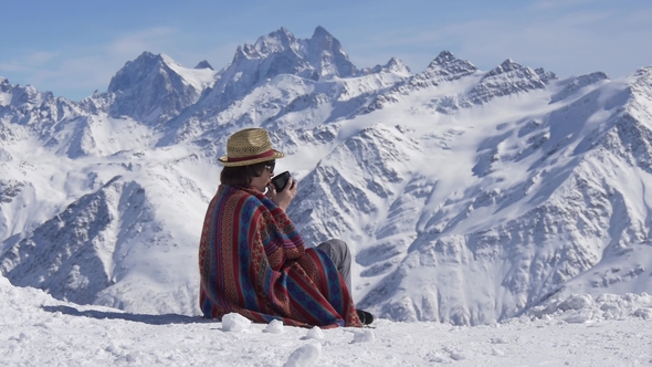 Woman Drinking Tea in the Mountains