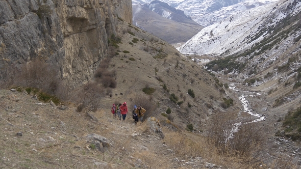 Group of Hikers in a Narrow Canyon