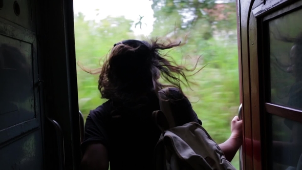 Girl Traveling by Train