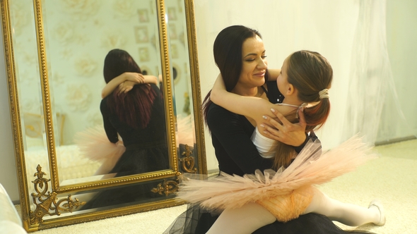 Mom Ballerina Hugs Her Daughter Ballerina