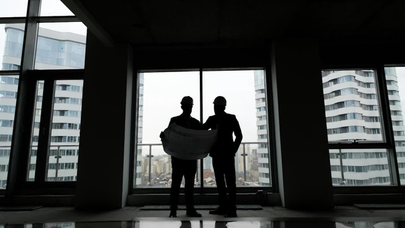 Construction Business: Two Mans with Blueprint alt