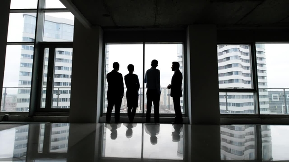 Business Team of Managers Standing Talk in Office alt