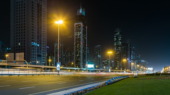 Car Traffic on Sheikh Zayed Road at Night in Downtown, Skyscrapers with Night Illumination. Dubai