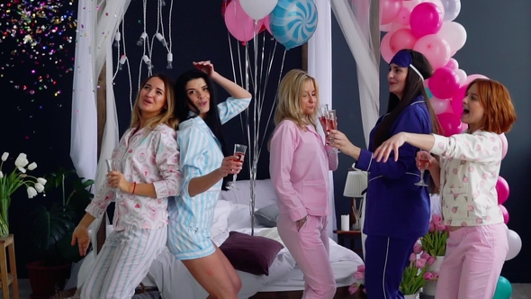 Group of Dancing Girls at a Pajama Party with Glasses of Champagne ...