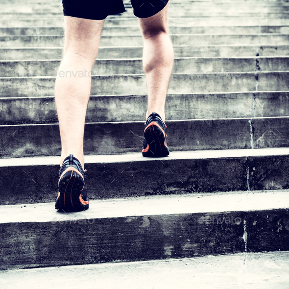 Jogger running on stairs sports training - Stock Photo - Images
