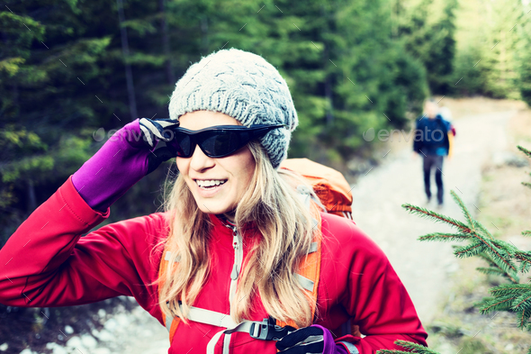 Couple hikers hiking in forest - Stock Photo - Images