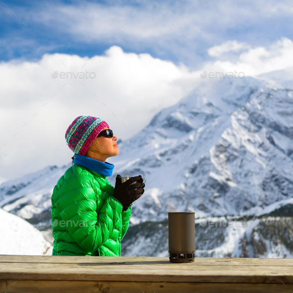 Woman drinking camping in mountains - Stock Photo - Images