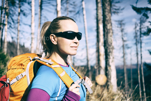 Woman hiking in winter autumn forest - Stock Photo - Images