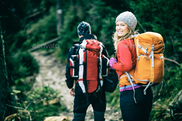 Couple hikers walking in mountains - Stock Photo - Images