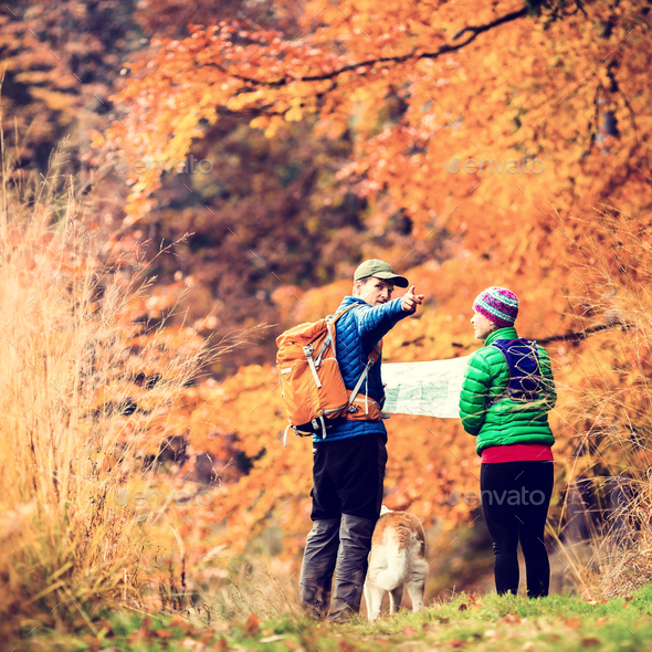 Vintage instagram couple hiking in autumn forest - Stock Photo - Images