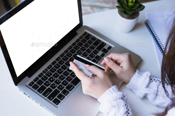 Ontslag efficiënt Nathaniel Ward woman holding credit card on laptop for online shopping concept Stock Photo  by ollinka