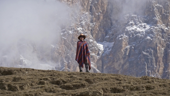 Original American Woman Standing in a Poncho