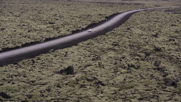 Iceland Country Roadway with Moving Car