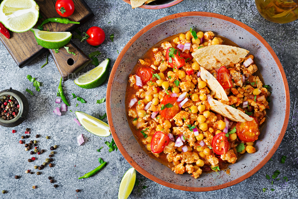 Chili con carne of turkey with chickpeas served with nachos. - Stock Photo - Images