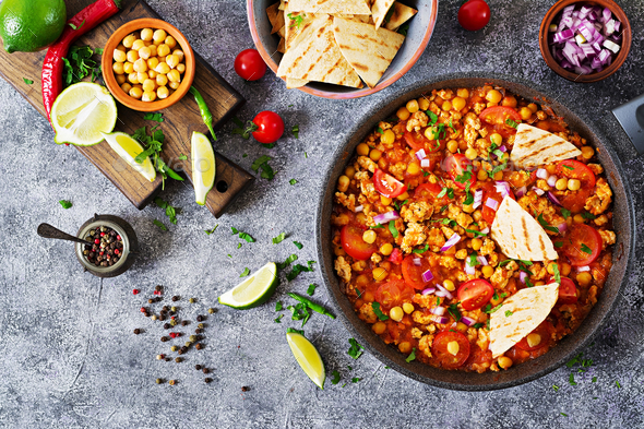 Chili con carne of turkey with chickpeas served with nachos. - Stock Photo - Images