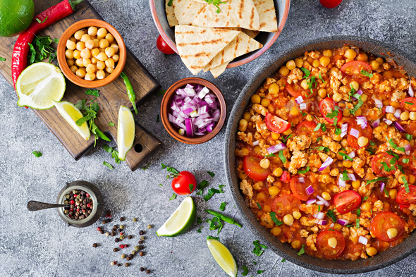 Chili con carne of turkey with chickpeas served with nachos - Stock Photo - Images