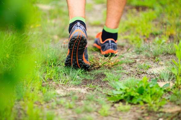 Sports shows running walking on trail - Stock Photo - Images