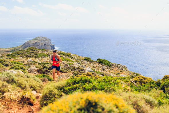 Happy trail running man in beautiful mountains Stock Photo by blas