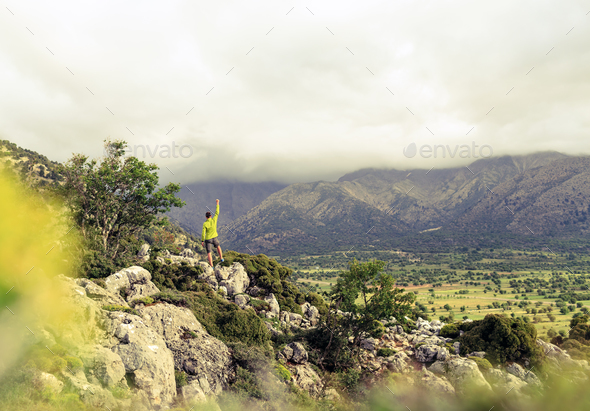 Hiking man looking at beautiful mountains success concept - Stock Photo - Images