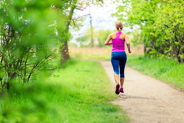 Woman jogging in summer park - Stock Photo - Images