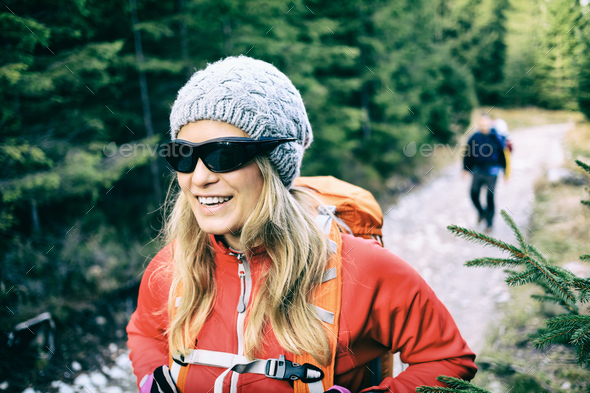 Couple hikers walking on trail in forest - Stock Photo - Images