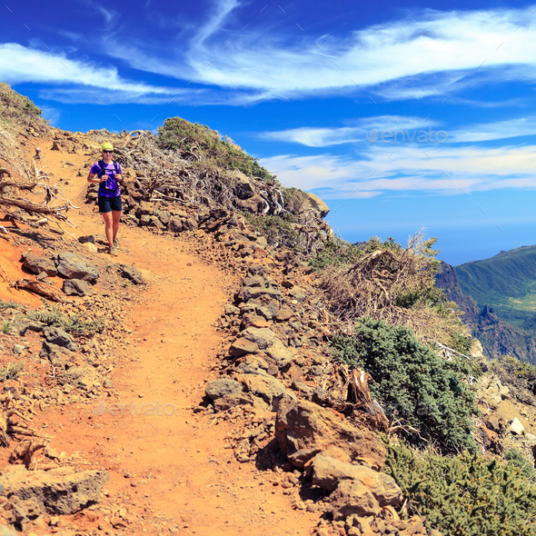 Hiking woman, runner hiker in summer mountains - Stock Photo - Images