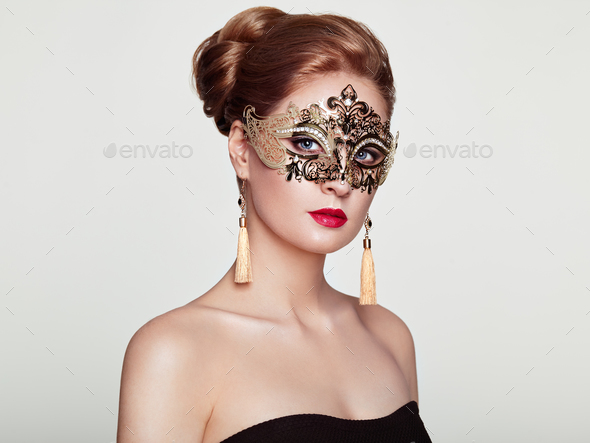 Beautiful woman in venetian masquerade mask - Stock Photo - Images