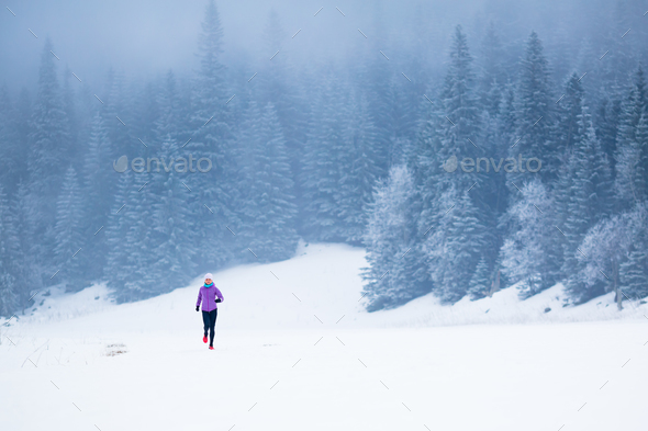 Winter running woman, jogging inspiration and motivation - Stock Photo - Images