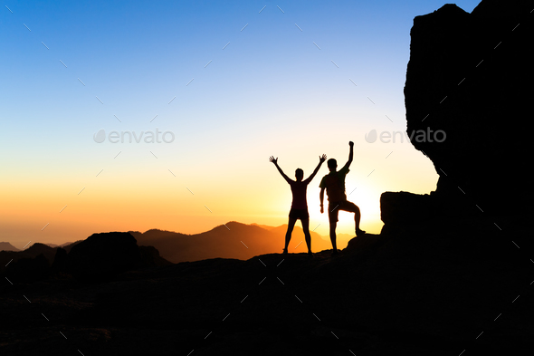 Couple hikers success concept in mountains - Stock Photo - Images