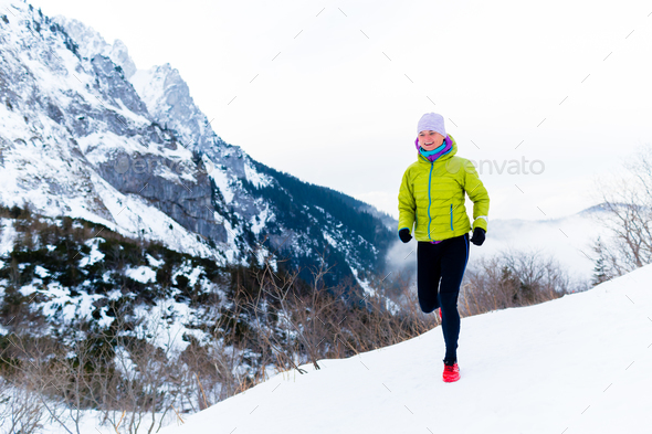 Woman running in winter, fitness inspiration and motivation - Stock Photo - Images