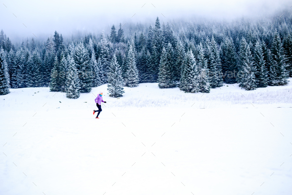 Woman running in winter, fitness inspiration and motivation - Stock Photo - Images