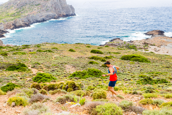 Cross country running man, inspirational mountains - Stock Photo - Images