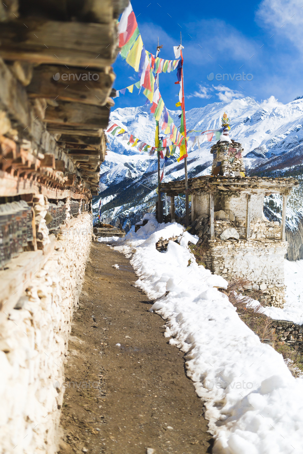 Prayer wheels in high Himalaya Mountains, Nepal village - Stock Photo - Images